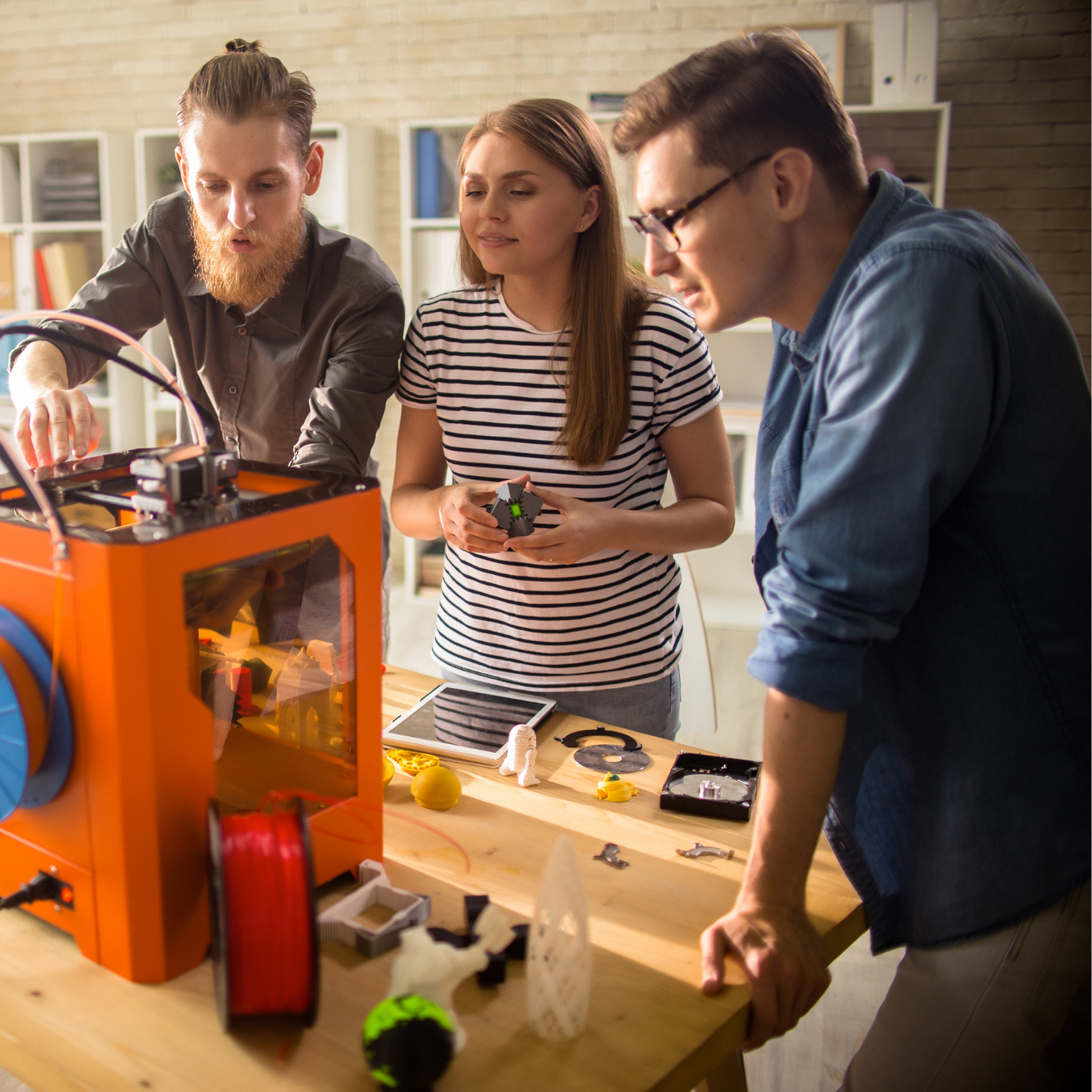 College students using filament 3D printer